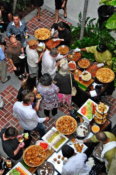 Food stations served finger foods like mini hamburgers, hot dogs, and tater tots.