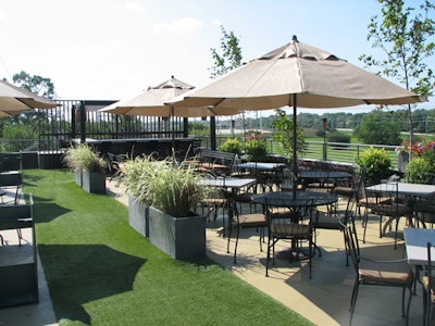 Umbrella-topped tables line the new rooftop terrace.