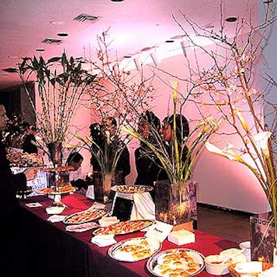 The buffet table was decorated with flowers by Starbright Floral and translucent picture boxes depicting images of the city printed by Duggal Color Projects