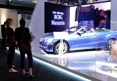 Title sponsor Mercedes-Benz produced two areas in the tent lobby, showcasing a blue 2011 E550 Cabriolet Designo and a silver 2011 CL63 in booths as sleek as those at the New York International Auto Show. LED backdrops at each displayed video footage of the runway shows.