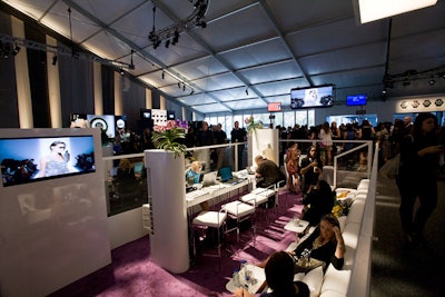 Packed throughout the week, AOL's media lounge sat in the center of the lobby, sunken into the elevated floor. To design the contemporary white and purple space, AOL tapped Garin Baura, who outfitted it with comfy banquettes, cocktail-style tables and stools, and a video screen for watching shows.
