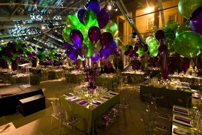 Purple ribbons anchored balloons to each of the 40 dinner tables.