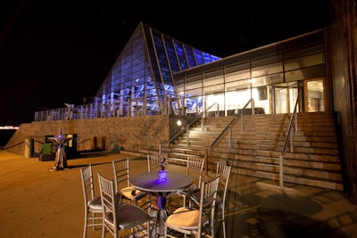 On the terrace, guests had cocktails at tables draped in silver linens.