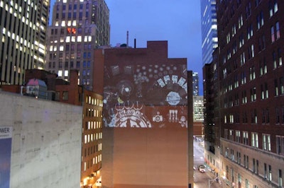 Organizers projected footage from 'Anthem,' the ad campaign shot for Absolut Vodka by Rupert Sanders, onto the wall of a building on Temperance Street.