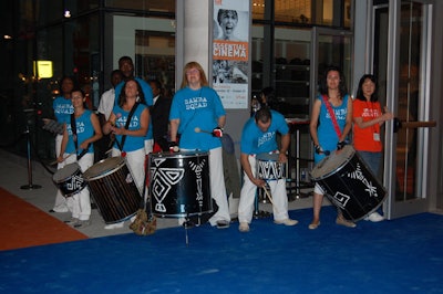 The Samba Squad performed outside the venue's main entrance, drawing a crowd of onlookers who lined the south side of King Street West to watch the performance.