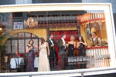 To promote its new show Boardwalk Empire, HBO partnered with Bloomingdale's to create a 1920s-themed window display. Event producers Civic Entertainment Group brought in Production Glue to design and execute the set, which included a men's haberdashery, a backroom distillery, a Prohibition-era party, and a 115-foot-long boardwalk that spanned the length of the store's Third Avenue façade.