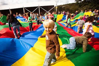 A massive, multicolored parachute was just one part of the many kids' activities at the festival.