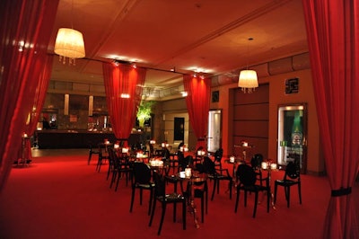 Jeffry Roick of McNabb Roick Events dressed the Carlu's grand foyer in red and black for the Amfar benefit. Roick installed a red carpet and used sheer red curtains to divide the space into intimate lounge areas for the cocktail reception.