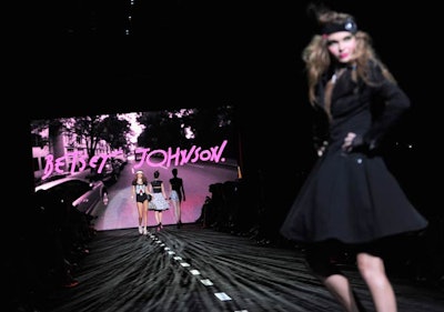 Betsey Johnson's Monday evening show in the Theatre venue of the tents was an homage to the Tour de France and the different neighborhoods of New York. As such, the catwalk was decorated with road markings, and the collection was divided into area-appropriate outfits, including black-and-white looks for the Upper East Side (pictured).