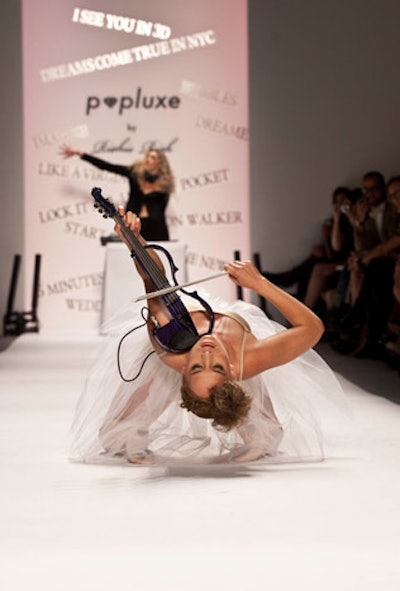 To open the Popluxe by Richie Rich show, electric violinist Caitlin Moe and DJ Mia Moretti—a new musical duo cropping up at events everywhere—performed on the runway.