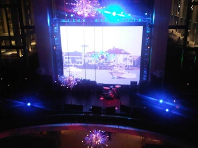 The Hilfiger anniversary event was held on four levels of the Metropolitan Opera House's atrium, including the second-tier balcony overlooking Josie Robertson Plaza. The Swarovski chandeliers that hung from the ceiling and above the performance stage are indigenous to the venue.