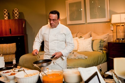 Chef Jim Mandio from Christafaro's Catering and Fine Foods to Go served made-to-order pasta at a cooking station amid the furniture displays.