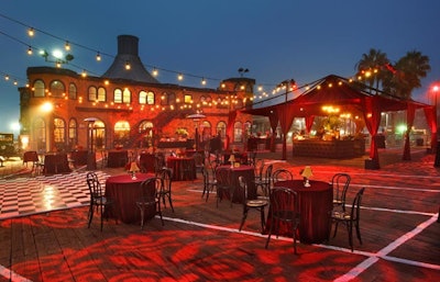 Carnival string lights hung overhead, and patterned gobos decorated the boardwalk surface.