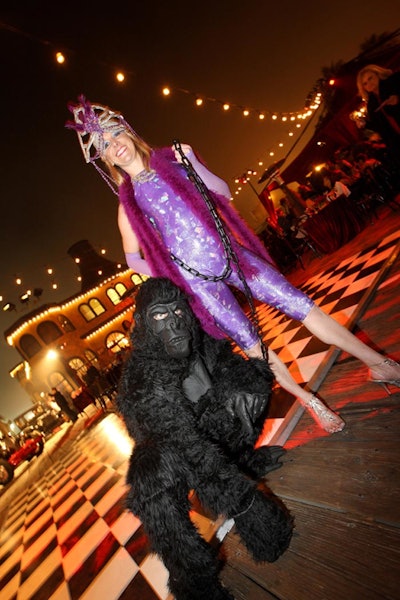 Carnival-style entertainers greeted guests at the party's entrance.