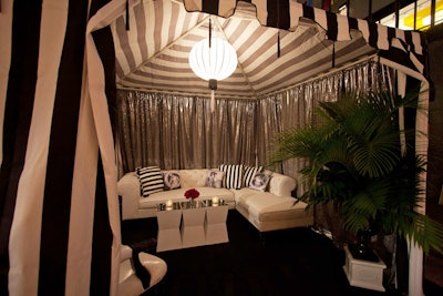 The venue for the New York post-screening event was divided into three distinct areas, one of which was the black- and white-toned Rink Bar. The producers built custom cabanas in this area, using striped draping to cloak the elevated seating and votive candles and seven-watt globe lights for illumination.