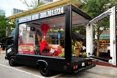 Go Big Adz parked one of its trucks, housing a vintage barbershop setup, on nearby South Miami Avenue to promote the event.