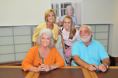 Deen and husband Michael Groover posed for photos with guests during the book signing.