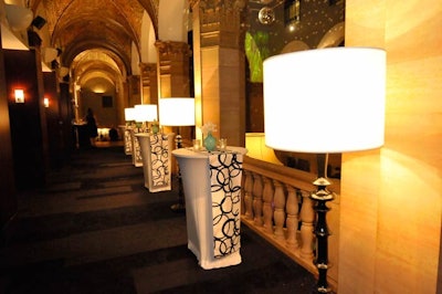 The event took place at the W Chicago City Center. On the upper level, highboy tables lined the hallway and a disco ball rotated from the center of the ceiling.