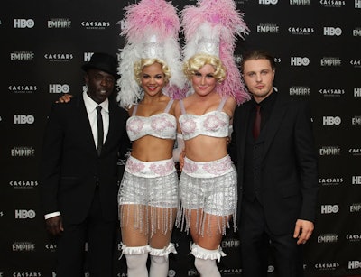 To point guests in the right direction and pose with Boardwalk Empire's stars, like Michael K. Williams (pictured, far left) and Michael Pitt (far right), the organizers of the Atlantic City affair provided showgirls and staffers outfitted in 1920s-style garb.