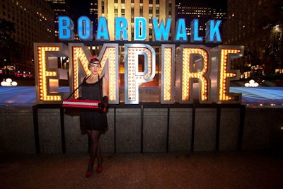 As a playful nod to Boardwalk Empire's central character, Nucky Thompson, the producers of the New York premiere party supplied a cigarette girl, who handed out red carnation boutonnieres to arriving guests.