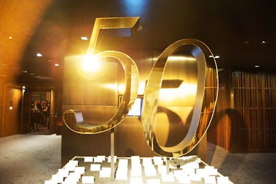 The golden '50' sculpture at the entrance was event producer David Stark's favorite part of the decor.