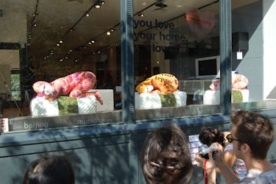 The weekend fair also provided performance art, such as the comic water balloon antics of the Acrobuffos and the Bindlestiff Family Cirkus variety show. Taiwanese artist Nung-Hsin Hu's 'Sushi' window display at Bo Concept (pictured) consisted of three performers sitting still atop sushi-roll-like pillows.