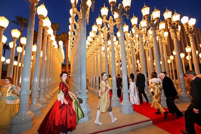 Guests entered the gala on a red carpet that snaked through the 'Urban Light' sculpture by Chris Burden, where entertainers in Venetian costume danced to a live pianist.