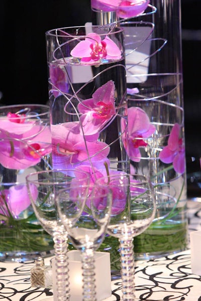 Karin's florists created six floral centerpieces for the different sections including the simple pink orchid centerpieces in the Toronto section.