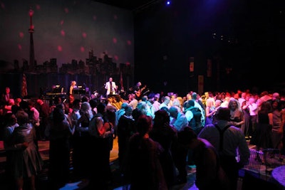The dance floor was situated underneath a wall-sized mural of the Toronto skyline.