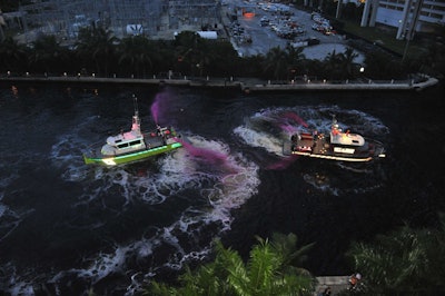 Fire boats from the City of Miami and Dade-County fire departments sprayed pink water in a Battle of the Fire Boats display.