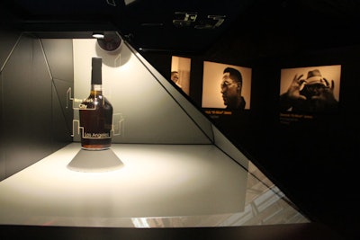 Glass-encased Hennessy bottles with branded holograms were on display in the art exhibit area, giving it the feel of a modern museum.