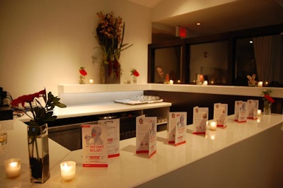 Brochures outlining the causes of teeth sensitivity and the benefits of Colgate's new toothpaste topped a bar in the event space at Sassafraz.