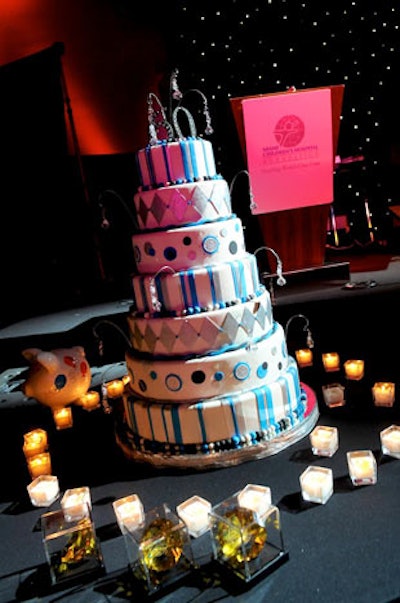 After giving testimonials about their experiences at Miami Children's Hospital, a group of former patients sang 'Happy Birthday' to the hospital around the eight-tier cake created for the occasion.