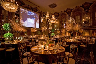 Some 4,000 golden branches and 1,000 candles went into the design of the Hilton-based dinner dance.