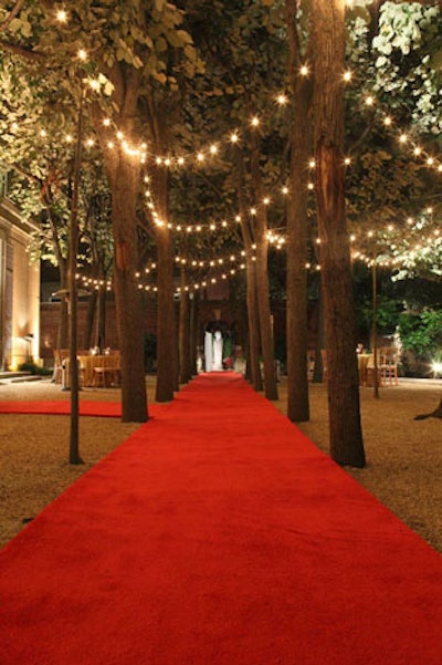 Stark's team lined the garden walkways with red carpeting and swathed the trees in sparkling lights.