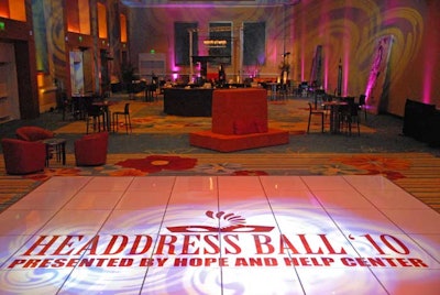 Letz Dance On It created a custom dance floor, incorporating the event logo, for the reception space.