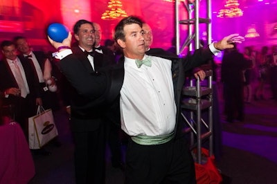 Guests played carnival games, including the football toss, during the cocktail hour and after dinner.