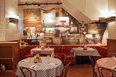 Red leather booths provide options for small groups.