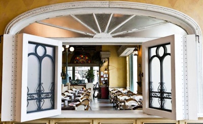 Architect Carlos Sobrin and thematic design firm Artisan Industry constructed the restaurant interiors using a variety of antique materials, including salvaged doors.