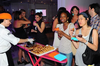 Staffers from Creative Edge used clothing irons to make grilled cheese sandwiches at a party celebrating New York-based event production firm MKG's new office space.
