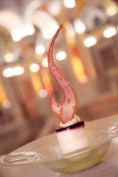 Grand Cuisine Caterers created a flame-topped white chocolate mascarpone cheesecake with blackberry gelée for a dinner at the Library of Congress honoring Paul McCartney's Gershwin Prize for Popular Song.