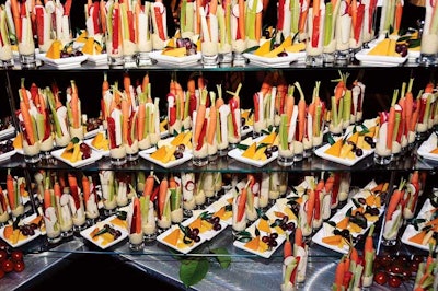 Guests helped themselves to cheese and fruit plates and shots of hummus with raw veggies at the AIDS Foundation of Chicago's 25th anniversary gala at the Hilton Chicago.