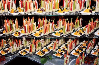 Guests helped themselves to cheese and fruit plates and shots of hummus with raw veggies at the AIDS Foundation of Chicago's 25th anniversary gala at the Hilton Chicago.