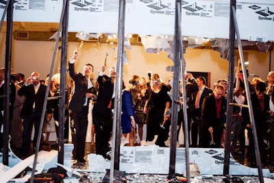 To get to the dance floor and the band at the Courage Forum, which was put on by the Americas Business Council, guests had to take cues from strategically placed hammers and destroy a wall of breakaway prop glass.