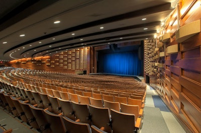 Repairs to the theatre included replastering the cantilevered ceiling and restoring the 1,700 cherry veneer wood panels that line the walls and the 1,500 rosewood slats that make up the undulating acoustic wall.
