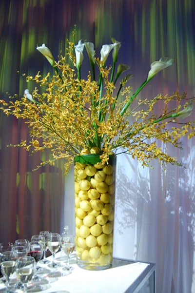 Tall vases filled with lemons and calla lilies topped bars and food stations throughout the venue.