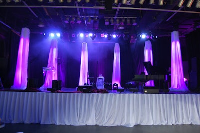 Six columns of fabric, lit in purple, provided a backdrop onstage at the Kool Haus.