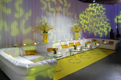 Laurence Heartz used white patent tufted sofas from Contemporary Furniture Rentals to create lounge areas for guests.