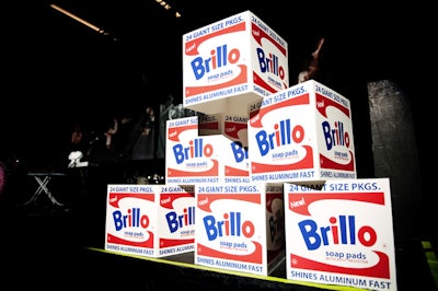 In a nod to Andy Warhol, event organizers stacked faux boxes of Brillo soap pads on either side of the stage.