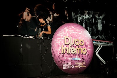Signage, designed to look like pink disco balls, highlighted various activations throughout the venue, including the booth where DJ Vaneska spun tunes.
